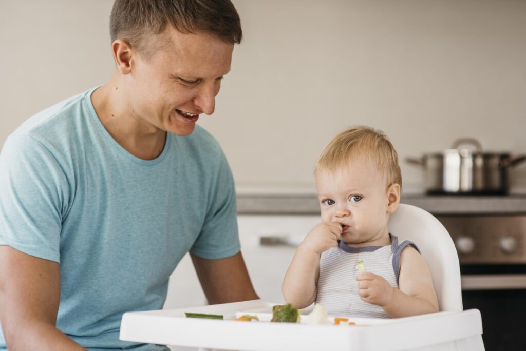 father-cute-baby-highchair-eating