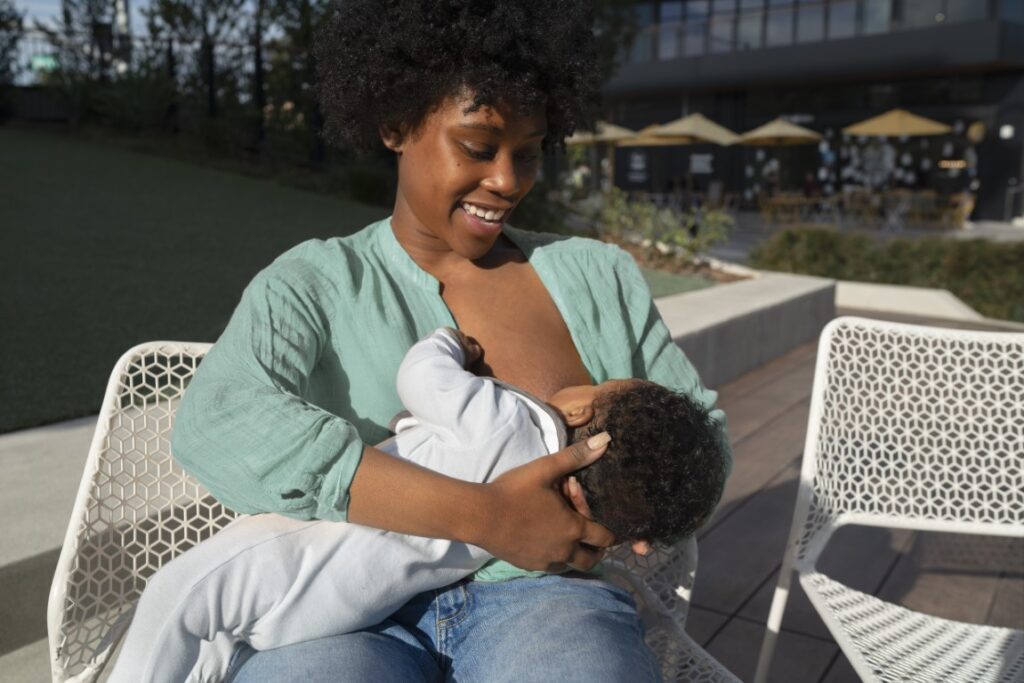 medium-shot-happy-mother-breastfeeding-baby