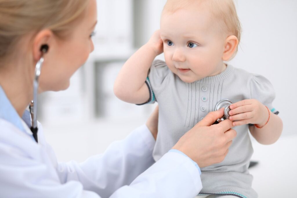 pediatrician-is-taking-care-baby-hospital-little-girl-is-being-examine-by-doctor-with-stethoscope